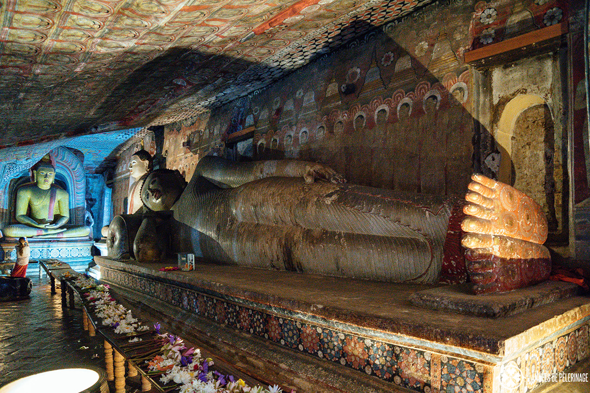 A sleeping Buddha statue inside the Dambulla Cave Temple - a unique UNESCO World Heritage site you have to put on your Sri Lanka itinerary