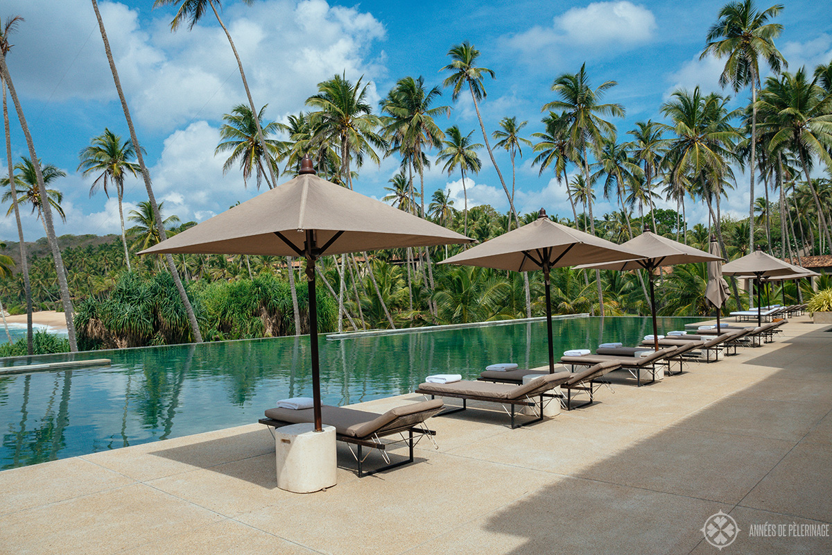 sun loungers at the main pool of the amanwella luxury hotel in sri lanka