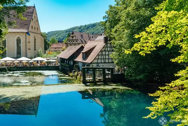 View of the Blautopf and the Blaubeuren Abbey in Germany