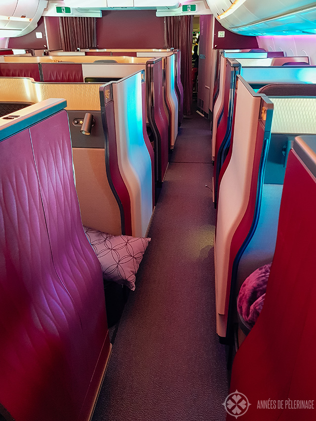 Look along the aisle of the Qsuites business class by Qatar Airways