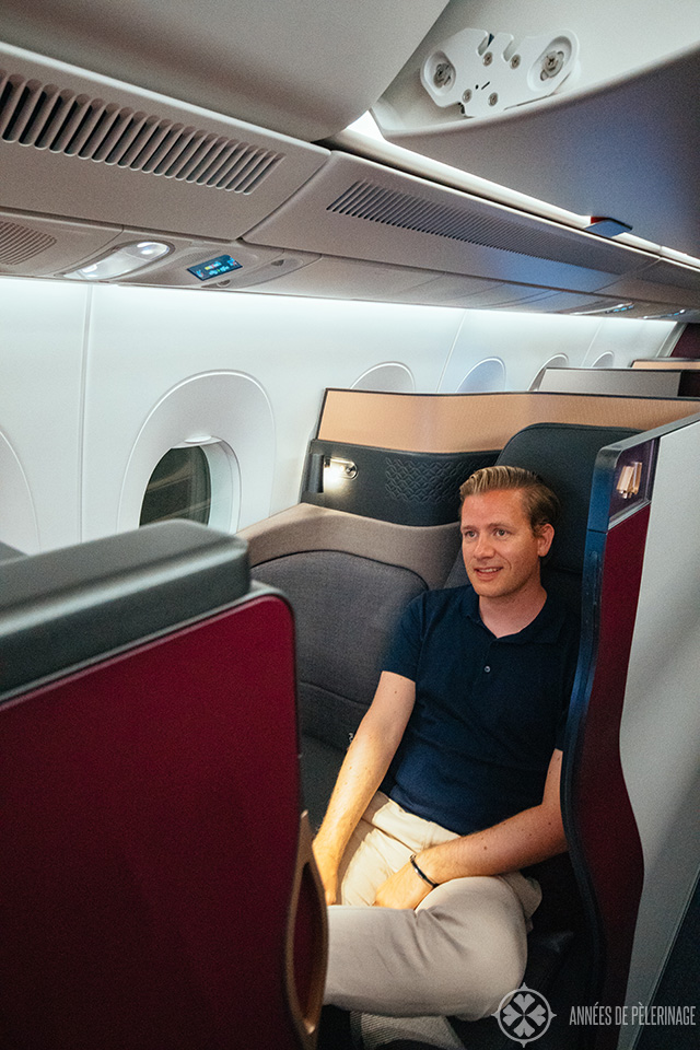 Me enjoying my QSuite (front-facing suite) of Qatar airways business class