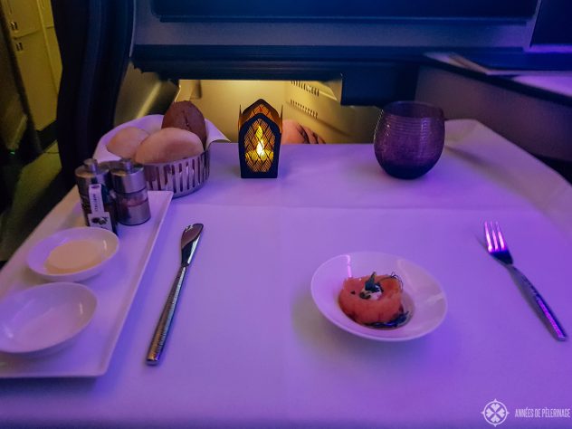 The dinner set-up inside the Qsuites - including LED candles