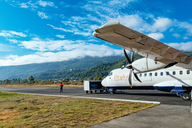 A Drukair propeller machine in Paro airport - where all international travelers arrive. Plane is the best way to get to Bhutan.