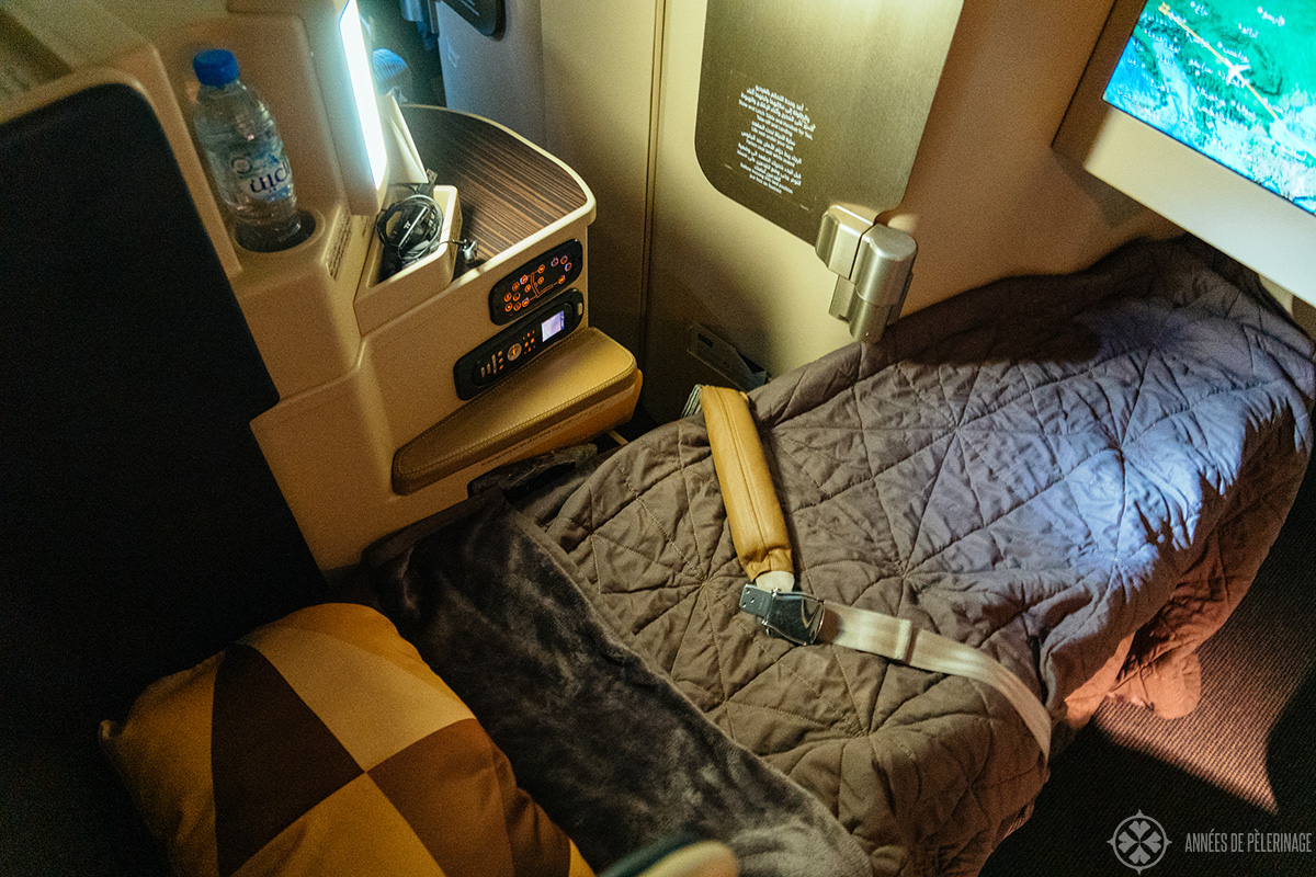 The business class seat of ethiad airways transformed into a bed at night
