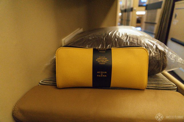 The small Aqua di Parma amenity kit provided in Etihad business class