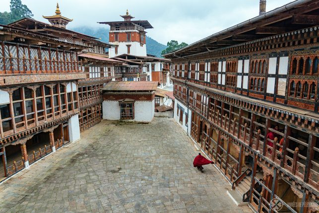 A monk walking inside Trongsa Dzong - Bhutan's longest dzong