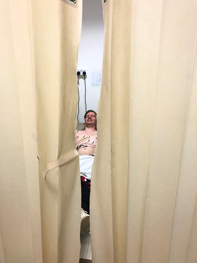 Behind a privacy curtain - getting an ECG at Abu Dhabi airport hospital