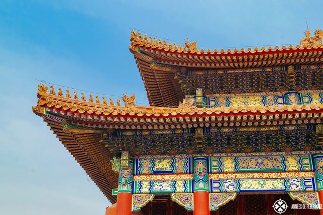 Rooftop detail with 9 glazed-tile dragons in the Forbidden City in Beijing
