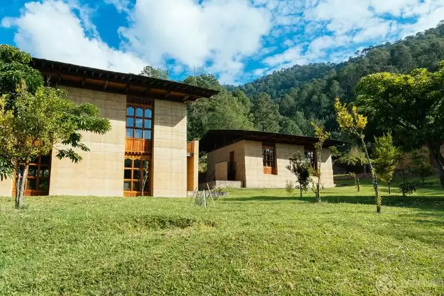 The guest houses of the lodge on a sunny day