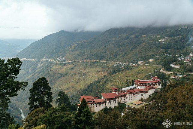 View of Trongsa Dzong from above on a cloudy day in Bhutan