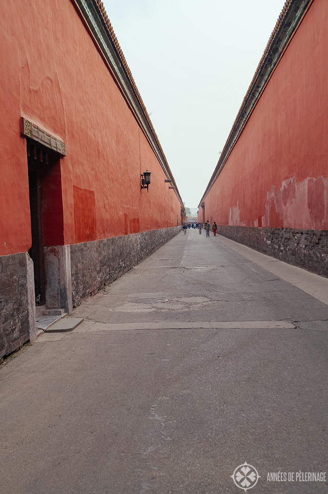 The red walls of the forbidden city in beijing - endless coridors hiding ancient treasures