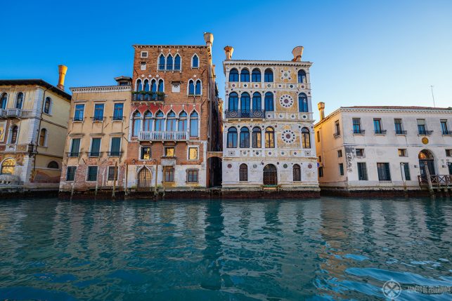 The crooked marble front of the ancient renaissance Palazzo Dario on the Canal Grande