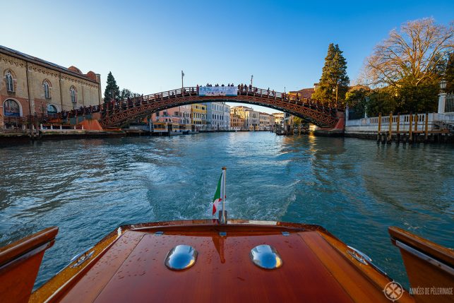 First person view of a boat driving through the Ponte dell'Accademia in Venice