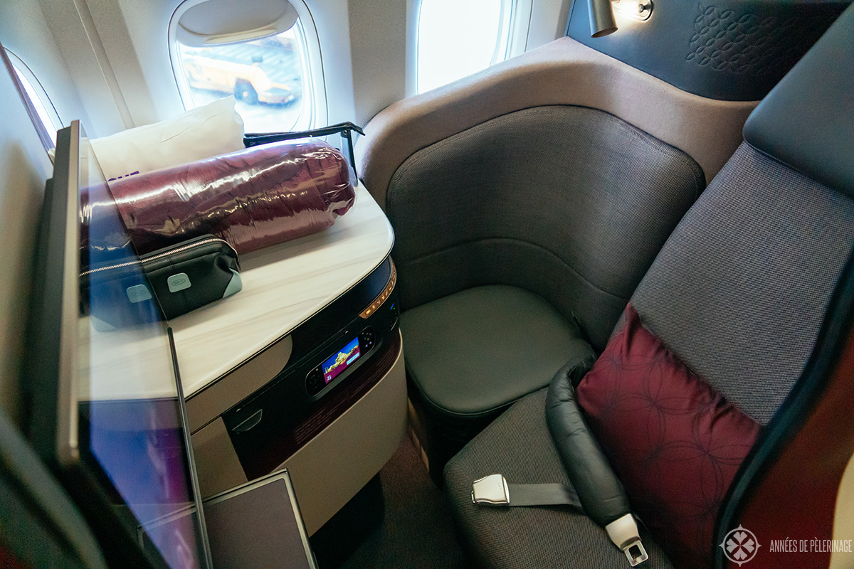 a business class seat of Qatar airways