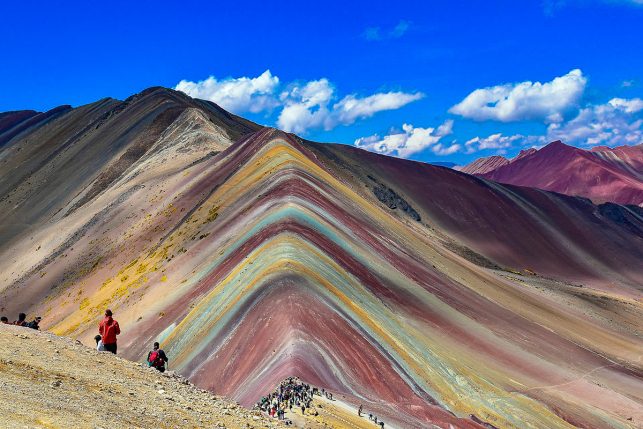 The famous view of the Rainbow Mountains one of the most popular day trips from Cusco of the past 5 years