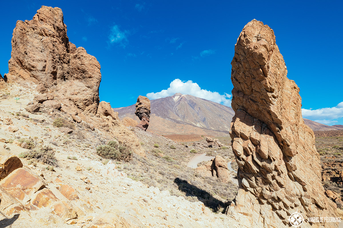 teide volcano framed by spectacular rock formations on both sides in the foreground