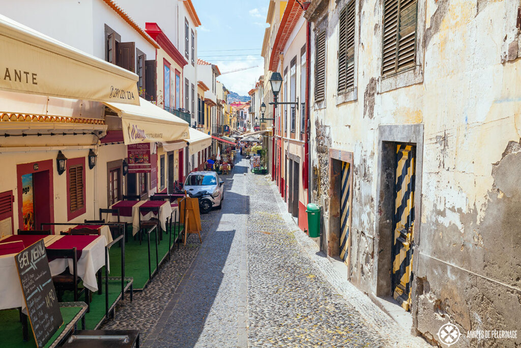 View along one of the many cobble stone streets in the old town of funchal