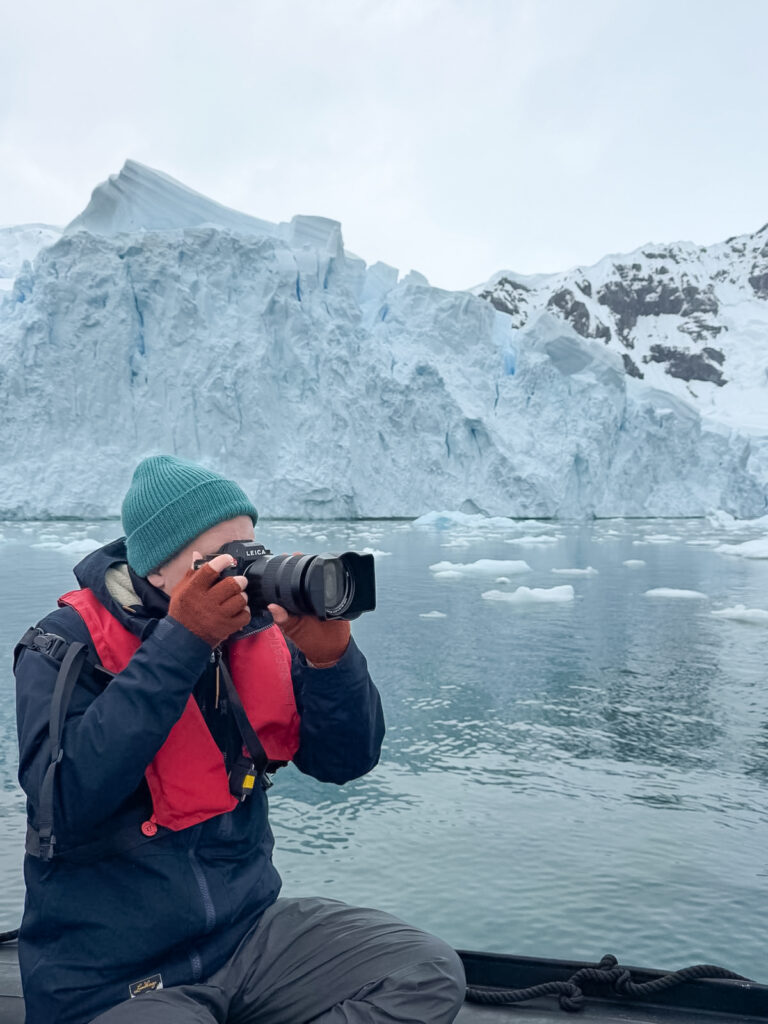me taking pictures wearing fingerlress gloves in antartica