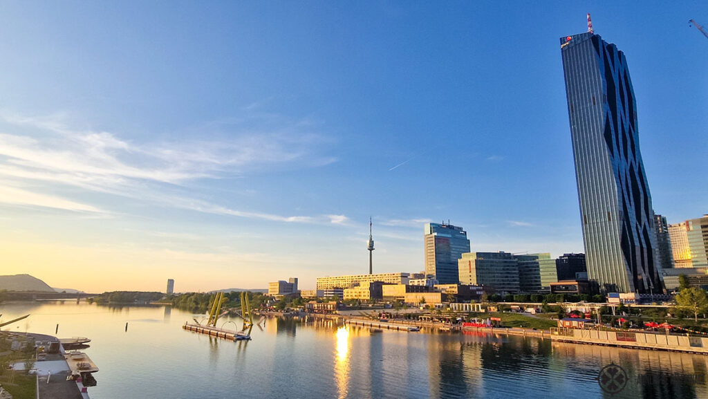 skyscrapers at the banks of the river danube in vienna close to sunset